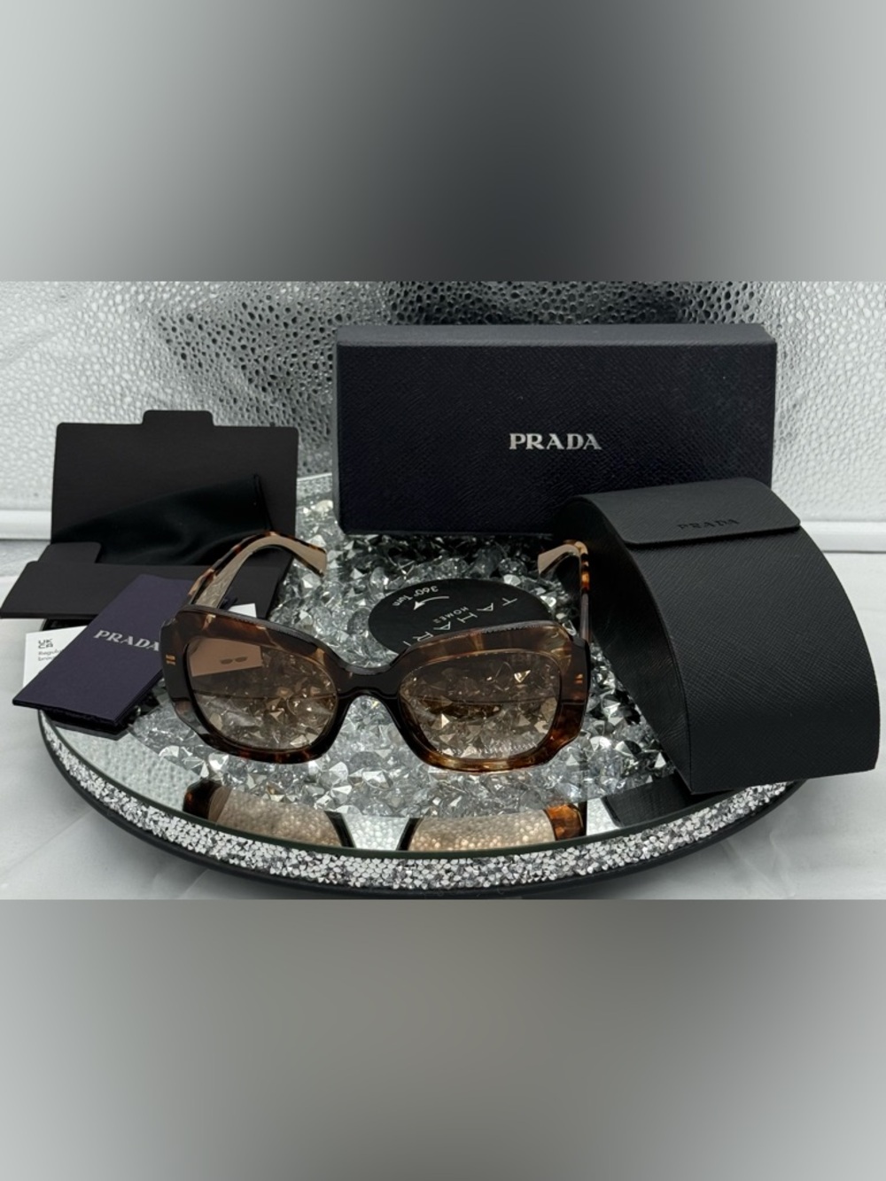 Prada PR 16YS sunglasses in Havana with brown gradient lenses.